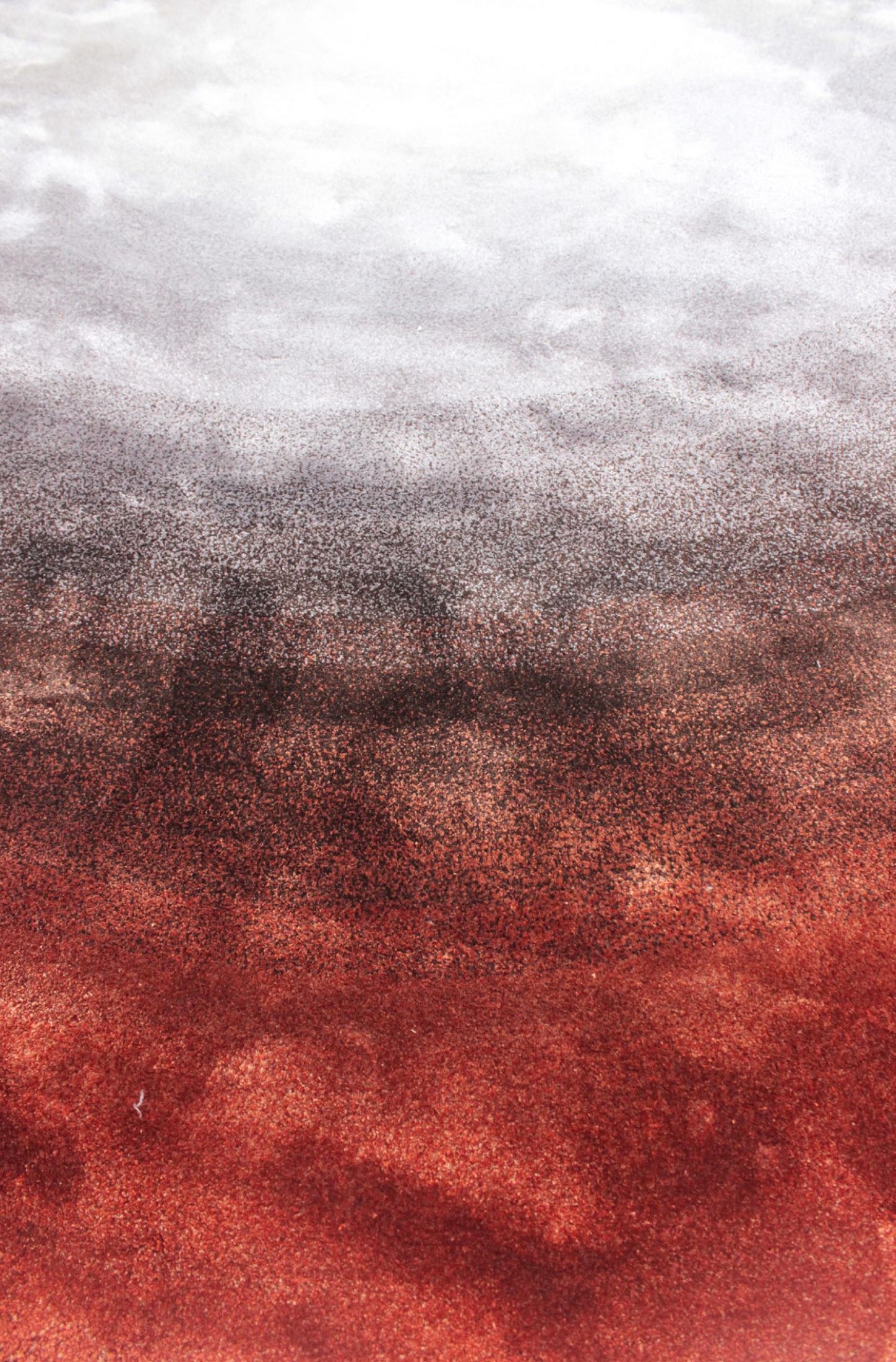 Close-up of Gradient, terracotta blending into charcoal and silver